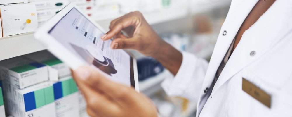 Person, hands or tablet with screen in drug store for stock inspection, report for medicine inventory. Female pharmacist, pharmacy or mockup for digital record of health information or pills research.